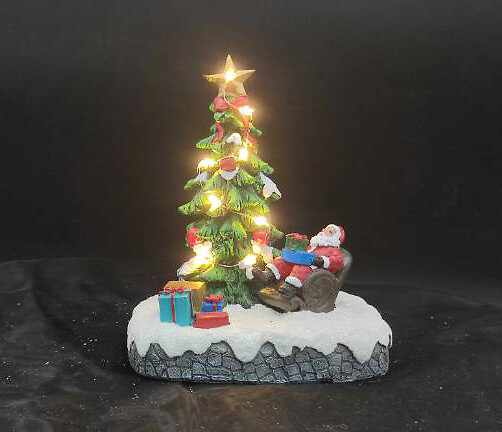 Aldeia com pai natal e pinheiro iluminado