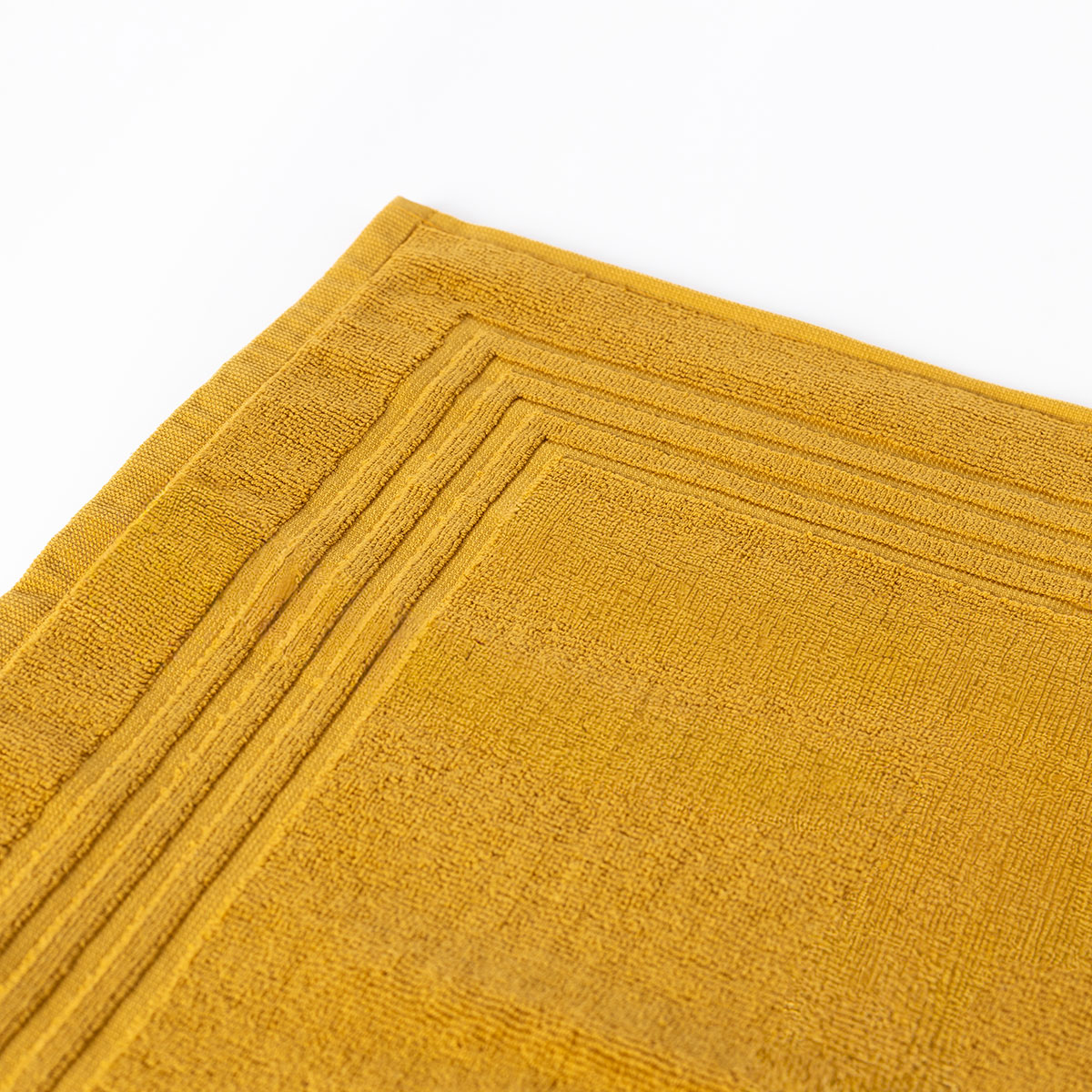 Tapete sa&iacute;da de banho ESSENZA amarelo 50x70cm