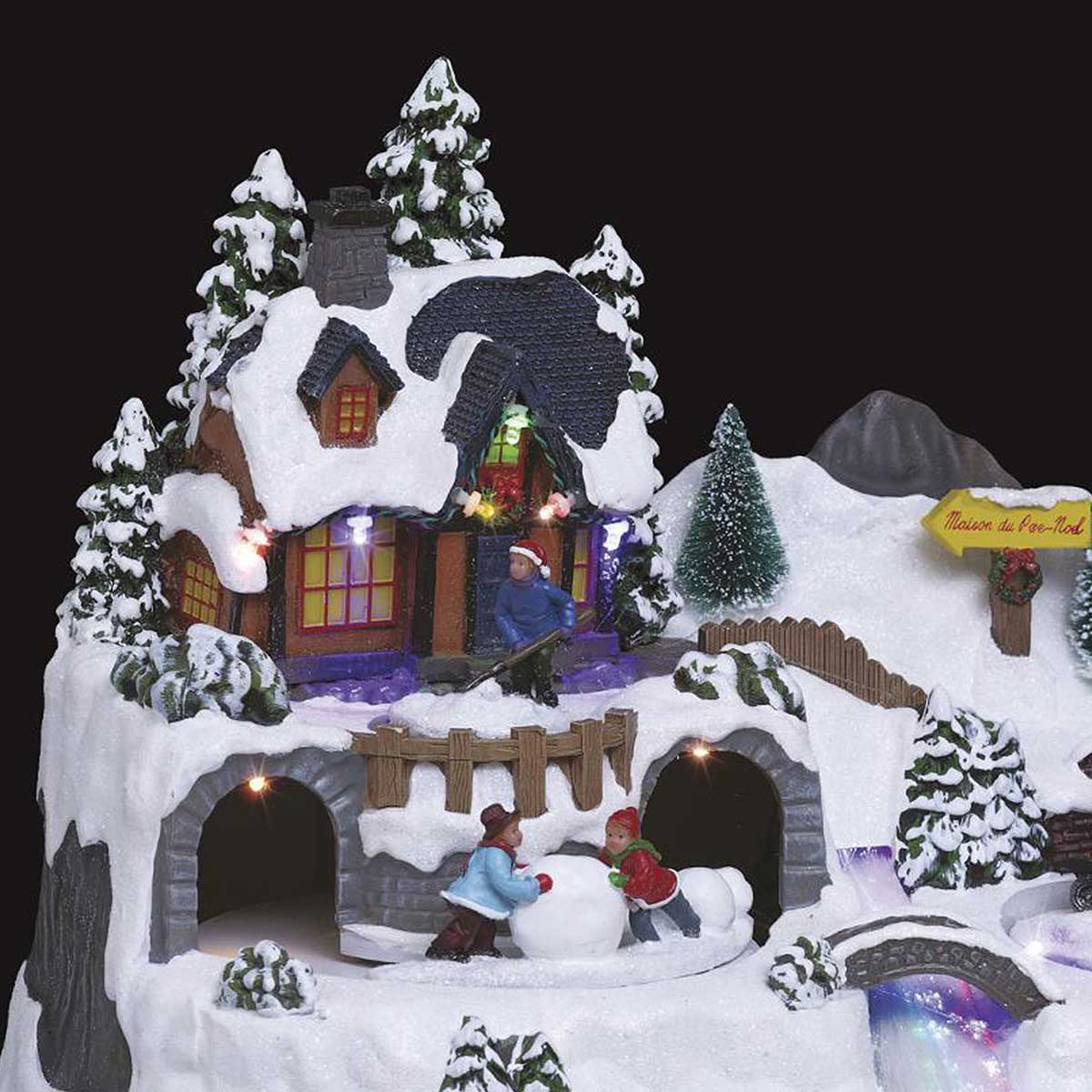 Aldeia natalícia luminosa com pai natal e crianças