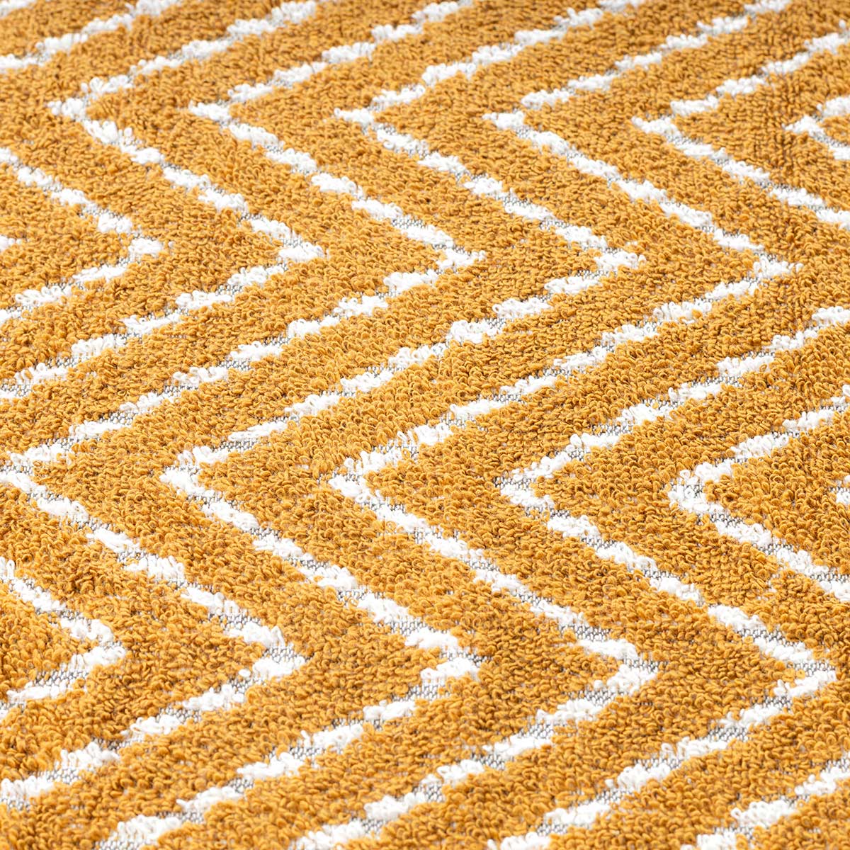 Toalha wc tribo ocre em algod&atilde;o 30x50cm